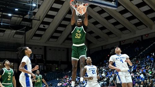 Greenforest's Daniel Daramola (32) dunks the ball against Manchester during the second half of GHSA Basketball Class A Division II Boy’s State Championship game at the Macon Centreplex, Wednesday, Mar. 6, 2024, in Macon. Greenforest Christian won 68-39 over Manchester. (Hyosub Shin / Hyosub.Shin@ajc.com)