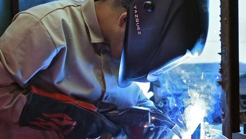 Nov. 13, 2015 - Jesus Vazquez works on a MIG welding assignment in welding lab. He is one of the students at Lanier Charter Career Academy that take a welding class at nearby Lanier Technical College. Gov. Nathan Deal’s Education Reform Commission is considering a request that the Technical College System of Georgia replace its admissions test with one that can create a “job ready” certification for skills, from welding to cosmetology, that could be obtained while in high school through dual enrollment in technical colleges. BOB ANDRES / BANDRES@AJC.COM