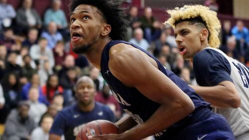 FILE - In this Jan. 16, 2017, file photo, Sierra Canyon's Marvin Bagley III looks to shoot against La Lumiere during a high school basketball game at the 2017 Hoophall Classic in Springfield, Mass. Top recruit Marvin Bagley III's decision to reclassify and become immediately eligible to play at Duke changed the national championship picture in college basketball. But what does it take to reclassify and go to college early? (AP Photo/Gregory Payan, File)