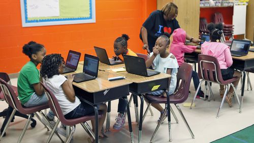 Atlanta Public Schools students gather in a third-grade computer coding class during the 2018 summer school program.  Bob Andres / bandres@ajc.com