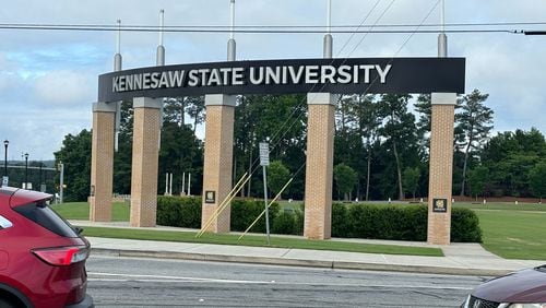The Kennesaw State University sign is seen on Sunday morning after a student was shot and killed Saturday afternoon.