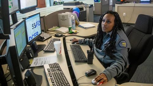 Operator Kelah Handley answers calls at Sandy Springs’ 911 dispatch center. The City Council has awarded a $198,334 contract to build a back-up 911 center on the fourth floor of City Hall. STEVE SCHAEFER / SPECIAL TO THE AJC
