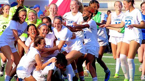 The Chamblee girls soccer team celebrates its 8-1 victory over Midtown in the Class 5A championship game at McEachern High School on May 5, 2022.