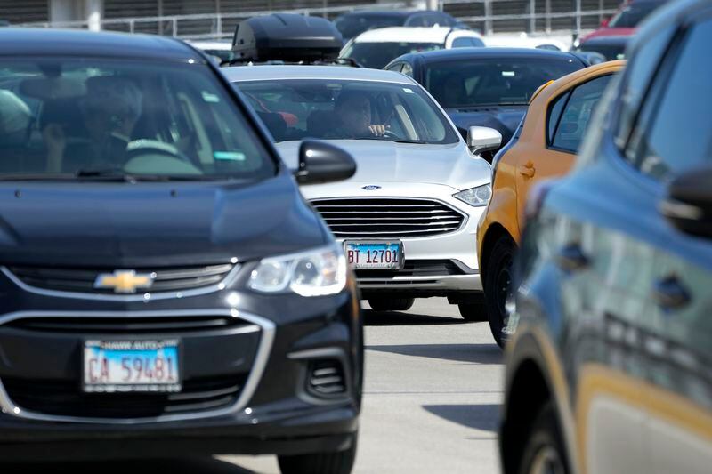 Traffic is backed up at O'Hare International Airport in Chicago, Monday, April 15, 2024. Pro-Palestinian demonstrators blocked a freeway leading to three Chicago O'Hare International Airport terminals Monday morning, temporarily stopping vehicle traffic into one of the nation's busiest airports and causing headaches for travelers. (AP Photo/Nam Y. Huh)