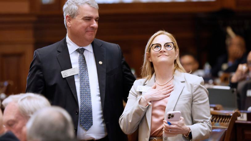 State Reps. Esther Panitch, D-Sandy Springs, and John Carson, R-Marietta, celebrate the passage of House Bill 30 on Monday during Crossover Day at the Capitol in Atlanta. HB 30 defines antisemitism so that it would be covered under Georgia’s hate crimes law. Miguel Martinez /miguel.martinezjimenez@ajc.com