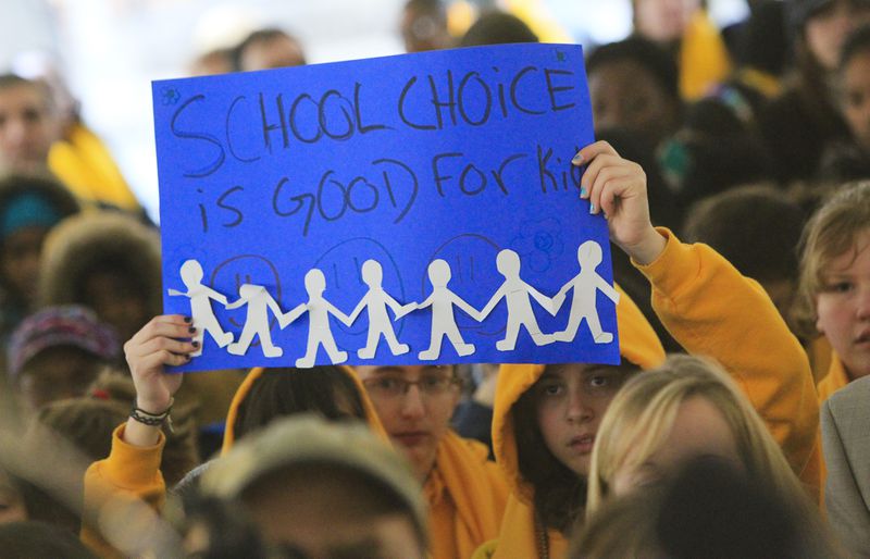 110125 Atlanta: Signs were everywhere Tuesday during the rally. Hundreds of parents and students attended the School Choice Celebration and Rally at the Georgia State Capitol Tuesday, Jan. 25, 2011. The gathering rallied to push state lawmakers to expand educational options for Georgia families. The event joined together unlikely allies, public and private school leaders in a display of unity where they urged lawmakers to expand scholarship opportunities so parents can better afford to pick their children's schools. Private schools want the state to raise the $50 million cap on the tax-credit scholarship that has helped hundreds of public school students transfer to private schools. Charter school officials want the state to support the continued funding of their campuses, which faces a state Supreme Court challenge from a handful of Georgia public school systems. The rally comes as the country celebrates National School Choice Week. David Pusey, director of a Center for an Educated Georgia, said more metro Atlanta parents appear to be concerned about choice than ever before, especially with accreditation problems at Atlanta Public Schools. John Spink jspink@ajc.com Her own experiences finding the right education fit for her child turned an Atlanta attorney into a school choice proponent. (AJC photo)