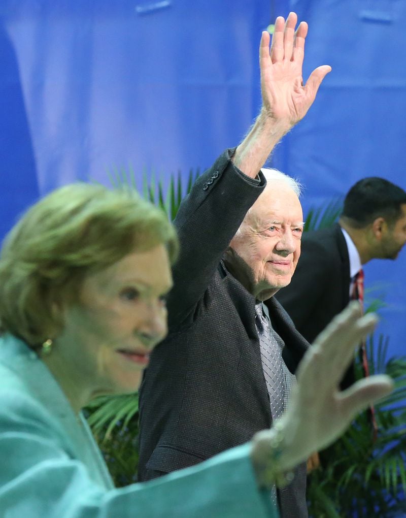 Former President Jimmy Carter and first lady Rosalynn wave to students as the conclusion of the annual Carter Town Hall at Emory University at the Woodruff P.E. Center in 2016. Curtis Compton /ccompton@ajc.com