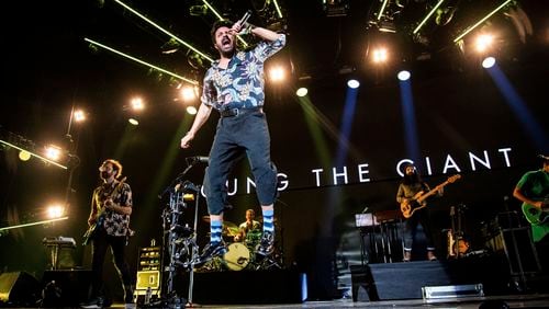 Jacob Tilley, from left, Sameer Gadhia, Francois Comtois and Payam Doostzadeh, of Young the Giant, perform at the 2018 KROQ Absolut Almost Acoustic Christmas at The Forum on Sunday, Dec. 9, 2018, in Inglewood, Calif. (Photo by Amy Harris/Invision/AP)