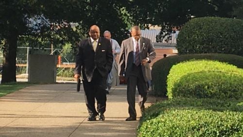 Former DeKalb County Commissioner Stan Watson, left, walks toward the county courthouse before his arraignment Tuesday, Aug. 1, 2017. Watson pleaded not guilty. MARK NIESSE / MARK.NIESSE@AJC.COM