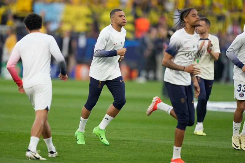 PSG's Kylian Mbappe warms up before the Champions League semifinal first leg soccer match between Borussia Dortmund and Paris Saint-Germain at the Signal-Iduna Park stadium in Dortmund, Germany, Wednesday, May 1, 2024. (AP Photo/Matthias Schrader)