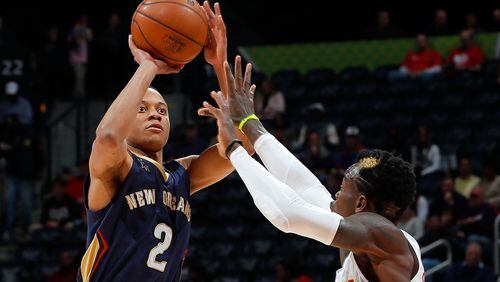 ATLANTA, GA - NOVEMBER 22: Tim Frazier #2 of the New Orleans Pelicans shoots against Dennis Schroder #17 of the Atlanta Hawks at Philips Arena on November 22, 2016 in Atlanta, Georgia. (Photo by Kevin C. Cox/Getty Images)