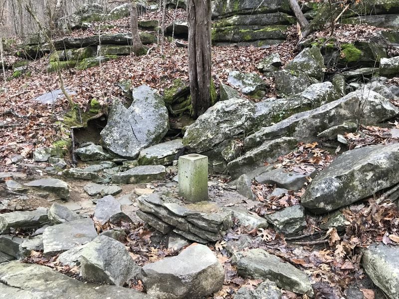 A rectangular concrete marker in the woods shows the current border at the corner of Alabama, Georgia and Tennessee. Georgia legislators are trying to move the border to the north so the state can gain access to water from the Tennessee River. Photo credit: Rep. Marc Morris