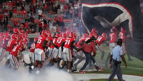 Georgia players run on to the field before Saturday's game at Sanford Stadium.