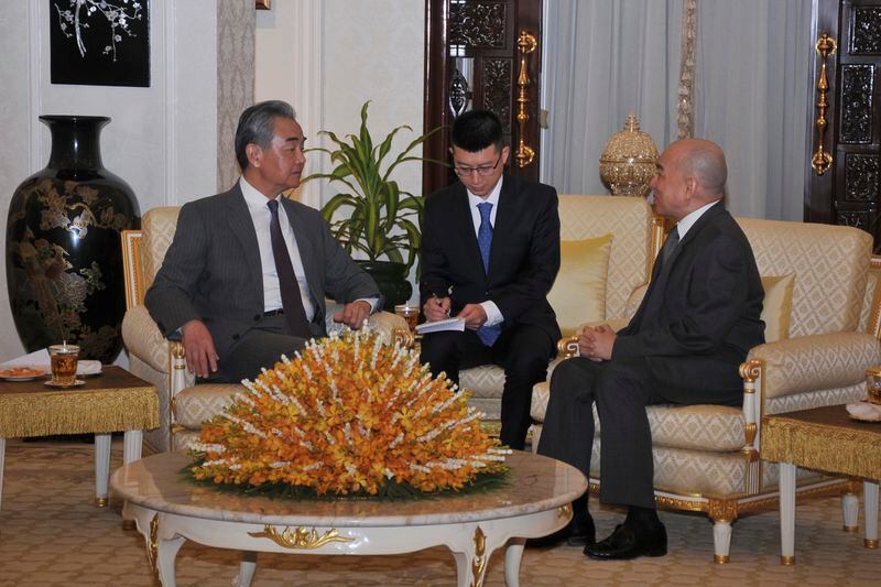 In this photo released by Agence Kampuchea Press (AKP), Chinese Foreign Minister Wang Yi, left, is welcome meeting by Cambodia's King Norodom Sihamoni, right, in Royal Palace, in Phnom Penh, Cambodia, Sunday, April 21, 2024. Wang Yi, arrived Cambodia to mark his 3 days official visit (21-23 April) Cambodia to reaffirm his country's commitment and to boost the already firmly tied to southeast Asian country, twice visited in the last eight months. (AKP via AP)