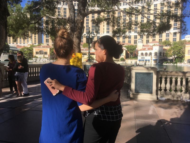 Etta Salaj, left, and Jessica Lugo comfort each other at the site of a memorial to the Las Vegas shooting victims. Photo: Jennifer Brett