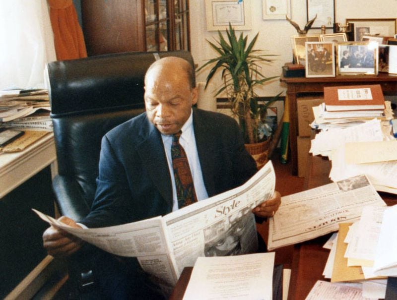 At 10:20 a.m., in a rare moment of quiet, the congressman catches up on news in his Capitol Hill office. Wednesday, May 20, 1992. (Rick McKay / AJC Archive at GSU Library AJCP452-147i)