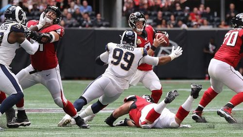 Rams defensive tackle Aaron Donald hits Falcons quarterback Matt Ryan causing a fumble that the Rams recovered and knocking Matt Ryan out of the game with an apparent injury during the fourth quarter Sunday, October 20, 2019, in Atlanta.    Curtis Compton/ccompton@ajc.com