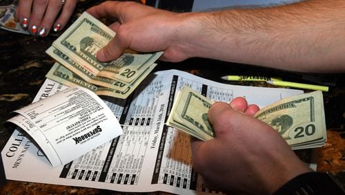Somebody puts down a wager during the NCAA men’s  college basketball tournament at the Westgate hotel and casino race and sportsbook in Las Vegas in March. Sportsbooks may soon become common across the U.S.