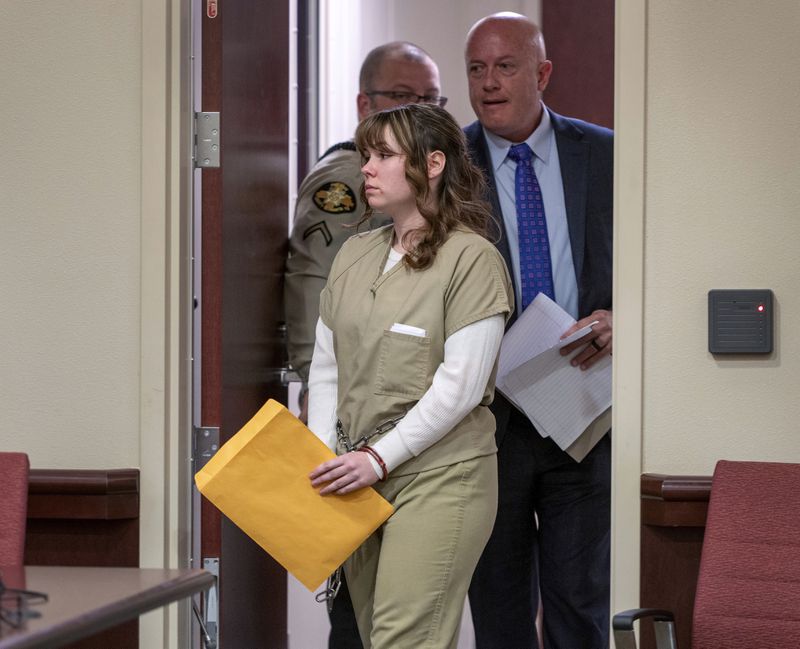 Hannah Gutierrez-Reed, with her attorney Jason Bowles, enters the courtroom for her sentencing hearing in Santa Fe, New Mexico, on Monday April 15, 2024. Gutierrez-Reed, armorer on the set of the Western film "Rust," was sentenced to 18 months in prison for involuntary manslaughter in the death of cinematographer Halyna Hutchins, who was fatally shot by Alec Baldwin in 2021. (Eddie Moore/The Albuquerque Journal via AP, Pool)