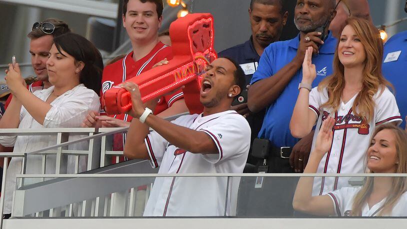 Ludacris leads the first chop from the Chop House during Atlanta Braves baseball game against the San Diego Padres at SunTrust Park on Saturday, April 15, 2017. HYOSUB SHIN / HSHIN@AJC.COM