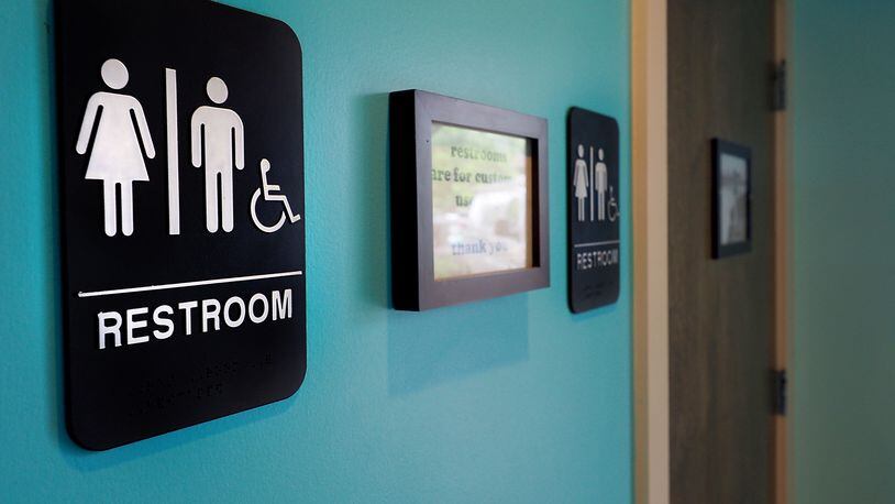 Unisex signs hang outside bathrooms at a restaurant in Durham, N.C. (Sara D. Davis / Getty Images)