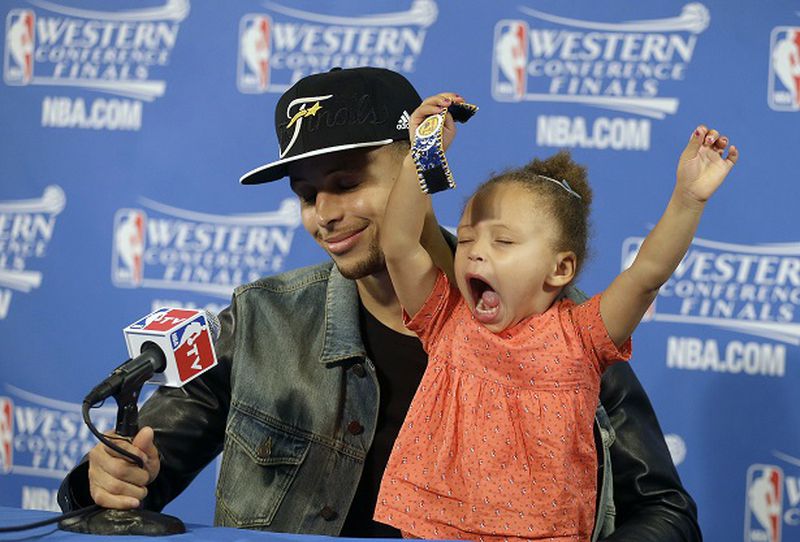 Golden State Warriors guard Stephen Curry is joined by his daughter Riley at a news conference after Game 5 of the NBA basketball Western Conference finals against the Houston Rockets in Oakland, Calif., Wednesday, May 27, 2015. The Warriors won 104-90 and advanced to the NBA Finals. (AP Photo/Ben Margot)