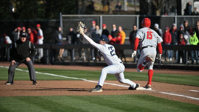Georgia Tech first baseman Drew Compton and Georgia's Cole Tate meet in a close play at first base in Georgia's 12-0 victory at Russ Chandler Stadium in Atlanta on Feb. 29, 2020. (Photo  by Danny Karnik/Georgia Tech Athletics)