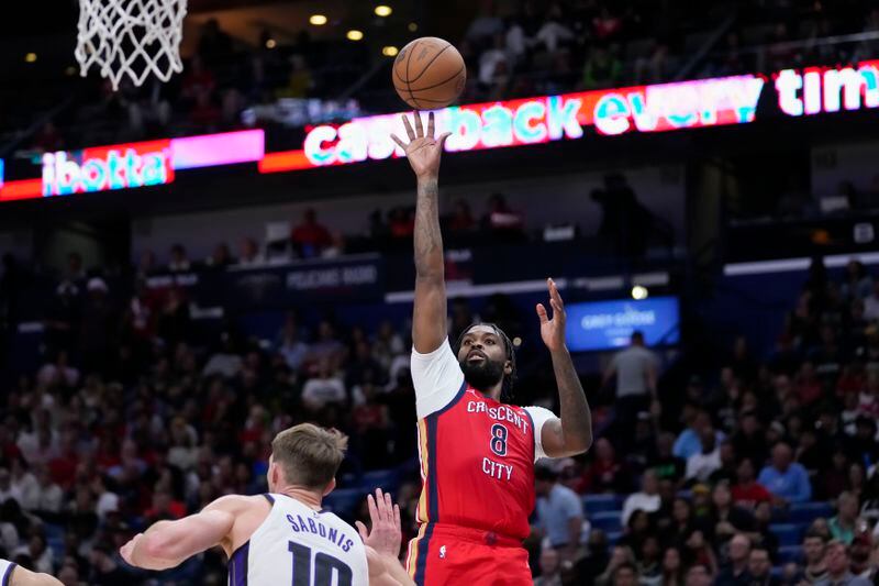 New Orleans Pelicans forward Naji Marshall (8) shoots over Sacramento Kings forward Domantas Sabonis (10) in the second half of an NBA basketball play-in tournament game in New Orleans, Friday, April 19, 2024. The Pelicans won 105-98. (AP Photo/Gerald Herbert)