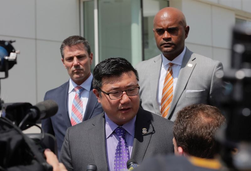 U.S. Attorney Byung J. "BJay" Pak, along with Chris Hacker, FBI Special Agent in charge and  Thomas Holloman III, IRS investigator, talk to media after Wednesday's hearing.  Bob Andres / bandres@ajc.com