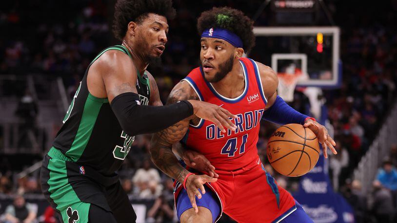 The Detroit Pistons' Saddiq Bey (41) works against the Boston Celtics' Marcus Smart (36) during the first half at Little Caesars Arena on Saturday, Feb. 26, 2022, in Detroit. (Gregory Shamus/Getty Images/TNS)