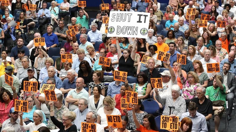 August 19, 2019 Marietta: Hundreds of opponents hold signs in opposition as Cobb officials and environmental regulators hold a town hall and community forum in the wake of reports that Cobb and Fulton have high levels of carcinogenic gas on Monday, August 19, 2019, in Marietta. A user and emitter of the gas, Sterigenics, which sterilizes medical equipment, operates in the area.  Curtis Compton/ccompton@ajc.com