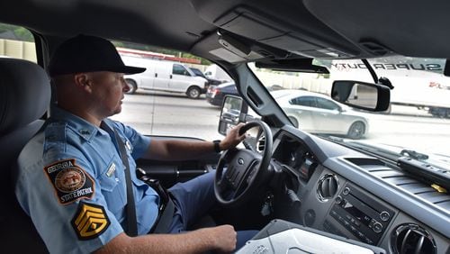 Sgt. First Class Chris Stallings monitors motorists in downtown Atlanta in this AJC file photo. Stallings has been named the new GEMA director. HYOSUB SHIN / HSHIN@AJC.COM