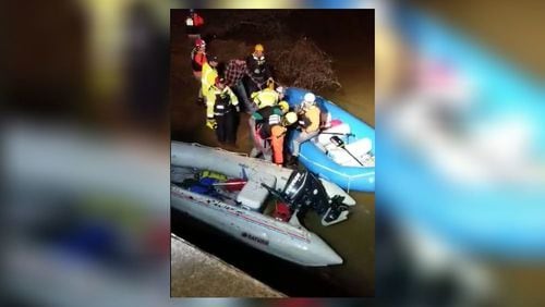 Rescuers used a motorized, inflatable raft to pull three kayakers stranded on Potato Creek in Upson County to safety Saturday night.