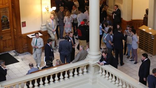 March 29, 2018 - Atlanta, Ga: Lawmakers, lobbyists, staff and other members of the public mingle outside of the House Chambers during Legislative Day 40 at the Georgia State Capitol Thursday, March 29, 2018, in Atlanta. PHOTO / JASON GETZ