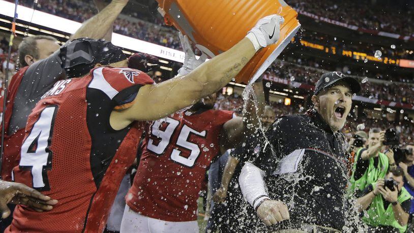Atlanta Falcons coach Dan Quinn reacts as he is dunked after the NFC championship game against the Green Bay Packers Sunday, Jan. 22, 2017, in Atlanta. The Falcons won 44-21 to advance to Super Bowl LI. (AP Photo/Mark Humphrey)