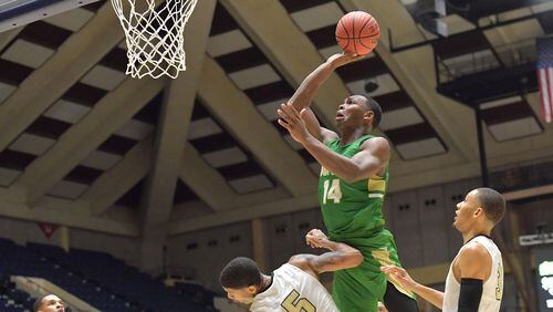 Buford's Marcus Watson (14) flies over Fayette County's Terrell Bradley during state championship tournament game at the Macon Centreplex Friday, March 8, 2019, in Macon. Buford won, 76-69.