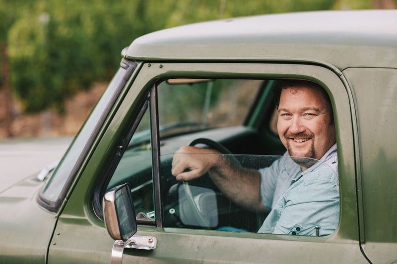 Tom Gore, a grape grower in Northern California, in his vintage truck. During a recent visit to Atlanta, he discussed how the October 2017 fires affected the Northern California wine country. (Photo credit: Tom Gore Vineyards)