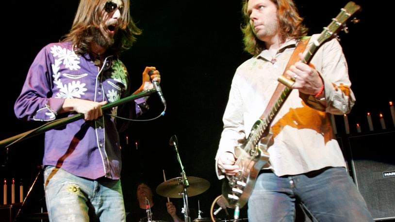 Vocalist Chris Robinson, left, and guitarist Rich Robinson of The Black Crowes perform with the band as the opening act for Tom Petty and the Heartbreakers at the Tweeter Center in Mansfield, Mass., on Saturday, June 18, 2005. (AP Photo/Robert E. Klein) Chris and Rich Robinson in more harmonious times in 2005. Photo: AP