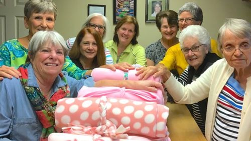 Volunteers with the Alpharetta Methodist Church Prayer Blanket Ministry with recently made prayer blankets. (Courtesy Alpharetta Methodist Church Prayer Blanket Ministry)