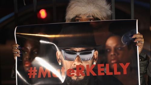 Demonstrators gather Jan. 9, 2019, in Chicago near the studio of singer R. Kelly to call for a boycott of his music after allegations of sexual abuse against young girls were raised on the Lifetime miniseries “Surviving R. Kelly.” Prosecutors in Illinois and Georgia have opened investigations into allegations made against the singer, whose real name is Robert Sylvester Kelly. SCOTT OLSON / GETTY IMAGES
