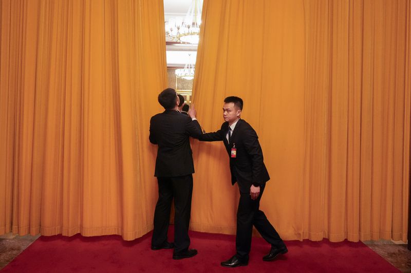 Officials close a curtain during a meeting between U.S. Secretary of State Antony Blinken and Chinese President Xi Jinping at the Great Hall of the People, Friday, April 26, 2024, in Beijing, China. (AP Photo/Mark Schiefelbein, Pool)