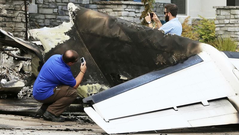 Federal Aviation Administration investigators document details of the wreckage where Duane Youd flew a Cessna 525 CitationJet into his own home early Monday, Aug. 13, 2018, in Payson, Utah. Youd, 47, was killed in the crash, which took place after he was charged with assaulting his wife the night before. The wife and her son, who were inside the house when the plane struck it, were unharmed.
