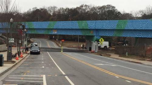 The overpass at West Trinity Place and Atlanta Avenue in Decatur as it looked last December when artists Felici Asteinza and Joey Fillastre temporarily suspended work on their mural. They returned recently and plan to finish the project by April 16.