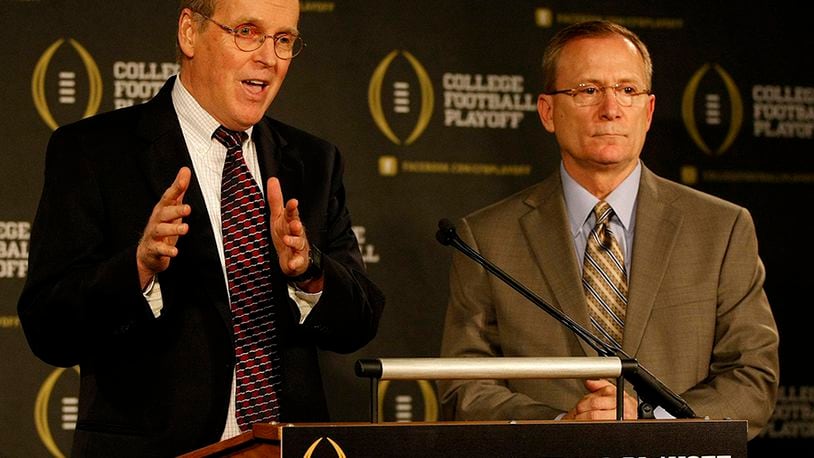 College Football Playoff executive director Bill Hancock (left) and committee chairman Jeff Long answer questions after announcing members of the selection committee in Irving, Texas, on Wednesday, Oct. 16, 2013.
