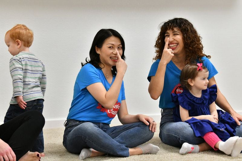Lan Lin (left) and Raina Sayer, who work at The Music Class, lead a class that will be shared online with families in China. With classes canceled in China during the coronavirus outbreak, they are filming classes here in Atlanta and broadcasting them free on a WeChat channel. (Hyosub Shin / Hyosub.Shin@ajc.com)