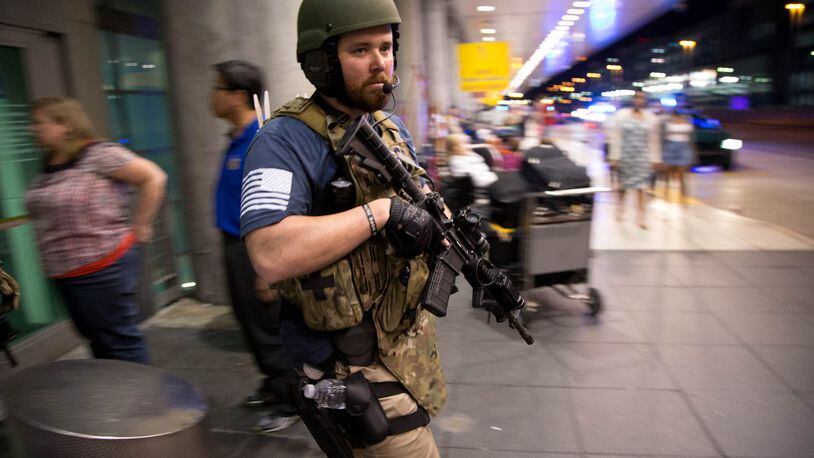 Police search for a gunman at Fort Lauderdale-Hollywood International Airport on Friday. Five people were killed and eight wounded in an attack from a single gunman near the baggage claim area in terminal 2. (Allen Eyestone / The Palm Beach Post)