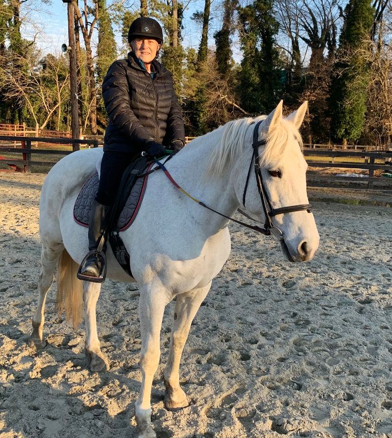 Jane Donofrio on her mare, Gracie, a Percheron-Arabian cross she boards at Little Creek Farm Conservancy.