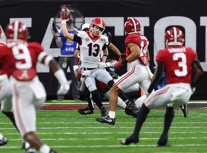 Officials ruled Georgia quarterback Stetson Bennett fumbled on this play as he is sacked and Alabama recovered during the 4th quarter in the College Football Playoff Championship game on Monday, Jan. 10, 2022, in Indianapolis.  “Curtis Compton / Curtis.Compton@ajc.com”`