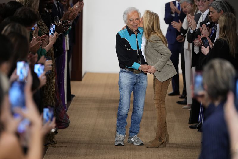 Ralph Lauren gets a kiss from his wife Ricky Ann Lauren at the conclusion of his Ralph Lauren Fall/Holiday 2024 presentation on Monday, April 29, 2024, in New York. (Photo by Charles Sykes/Invision/AP)