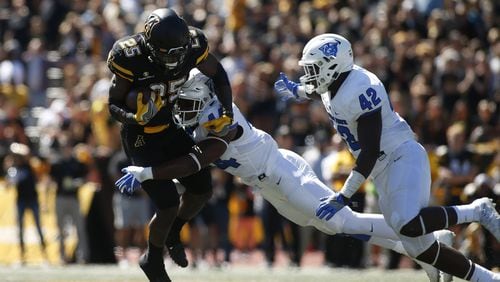 Running back Jalin Moore of Appalachian State is stopped on a carry by GSU linebacker Michael Shaw (44) and linebacker Trey Payne during the second quarter on Oct. 1, 2016 at Kidd Brewer Stadium in Boone, N.C. (Photo by Brian Blanco/Getty Images)